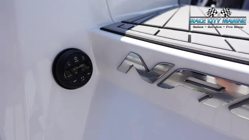 Slide: The Image of 2020 Nautique Super Air Nautique G23 boat detail with audio controls and logo. - 15