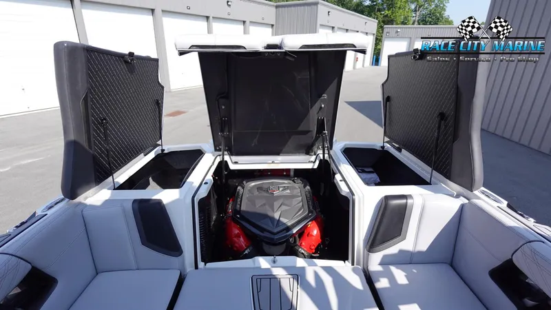 Slide: The Image of 2020 Nautique Super Air Nautique G23 engine compartment, open hatches, Race City Marine logo. - 18