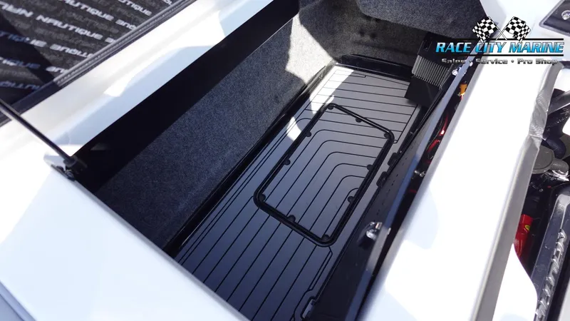 Slide: The Image of 2020 Nautique Super Air Nautique G23 storage compartment, Race City Marine logo visible. - 20
