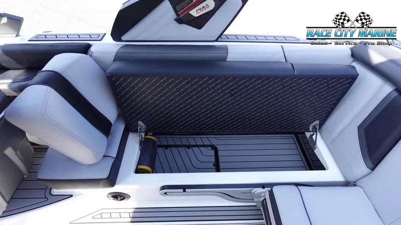 Slide: The Image of 2020 Nautique Super Air Nautique G23 interior seating and storage compartment. - 25