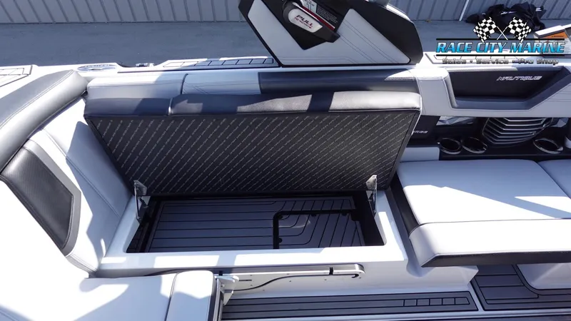 Slide: The Image of 2020 Nautique Super Air Nautique G23 interior with open storage compartment. - 26