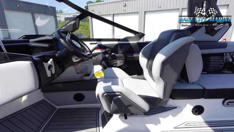 Slide: The Image of 2020 Nautique Super Air Nautique G23 boat interior with modern helm and seating. - 32