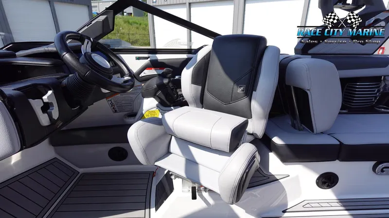 Slide: The Image of 2020 Nautique Super Air Nautique G23 interior with premium seating and steering wheel. - 33