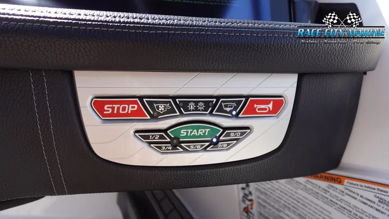 Slide: The Image of Control panel of 2020 Nautique Super Air Nautique G23 boat with start and stop buttons. - 36