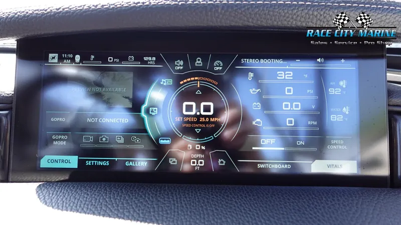 Slide: The Image of 2020 Nautique Super Air Nautique G23 digital dashboard display with control settings. - 39