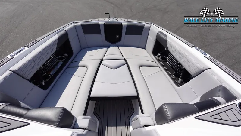 Slide: The Image of 2020 Nautique Super Air Nautique G23 boat interior with gray seating and Race City Marine logo. - 42