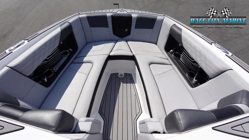 Slide: The Image of 2020 Nautique Super Air Nautique G23 boat interior with sleek seating and cup holders. - 43