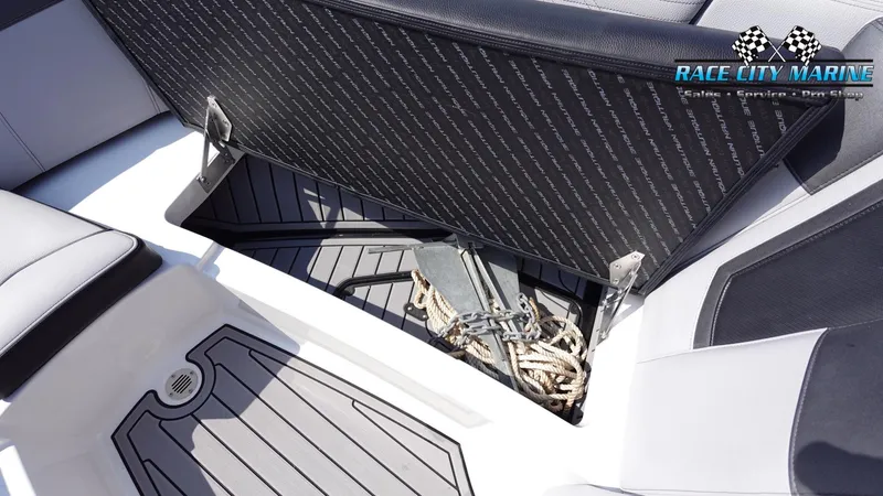 Slide: The Image of 2020 Nautique Super Air Nautique G23 interior storage compartment with anchor and rope. - 48