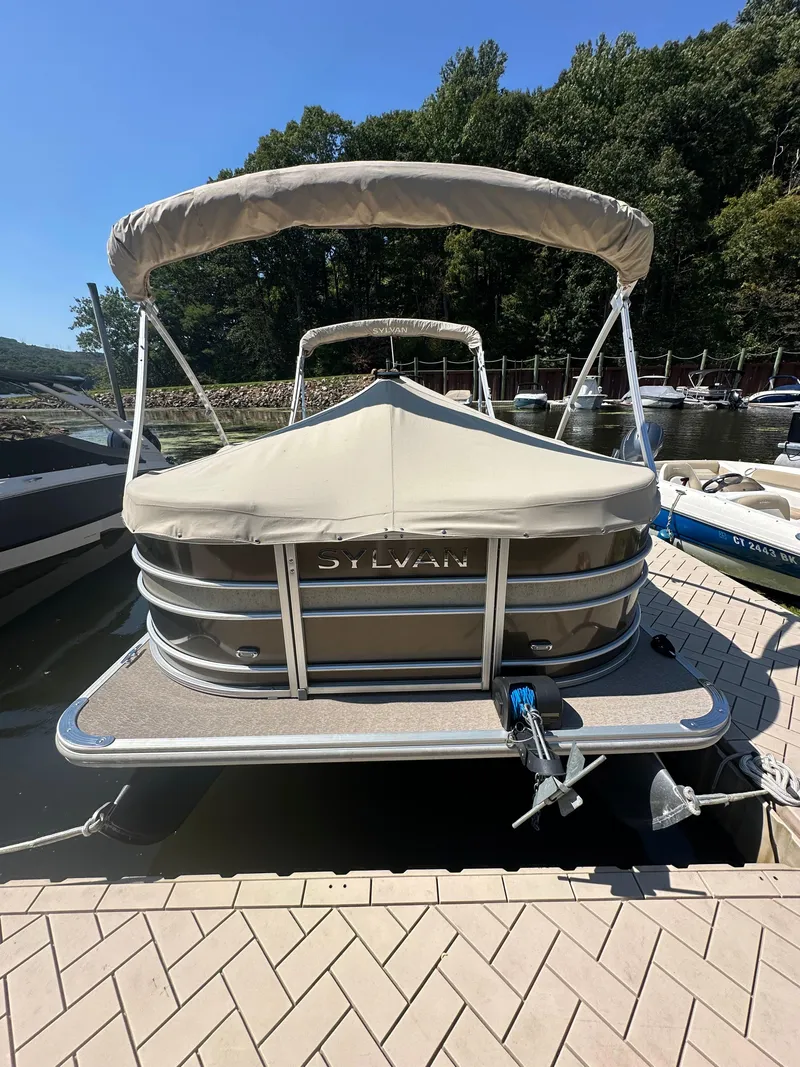 Slide: The Image of 2019 Sylvan Mirage 8522 LZ pontoon boat docked at a marina. - 12