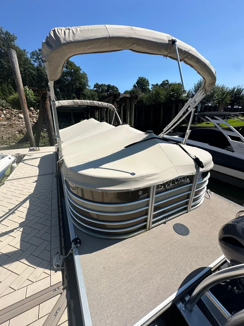 Slide: The Image of 2019 Sylvan Mirage 8522 LZ pontoon boat docked with canopy. - 18