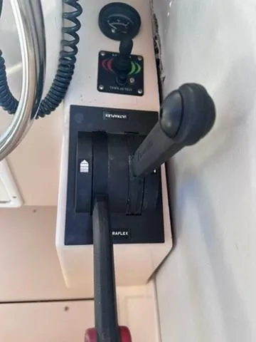 Slide: The Image of Close-up of throttle controls on a 1999 Atlas Boat Works Acadia 25. - 23