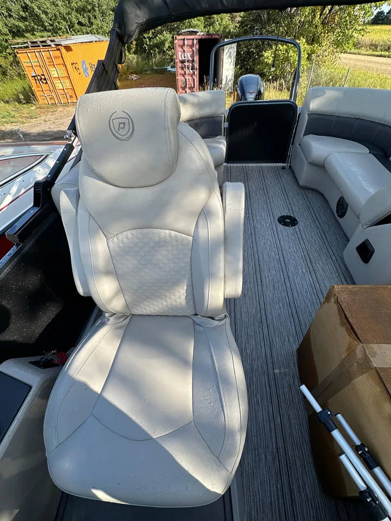 Slide: The Image of Luxurious interior of 2022 Premier 230 SunSation RF pontoon boat with plush seating. - 10