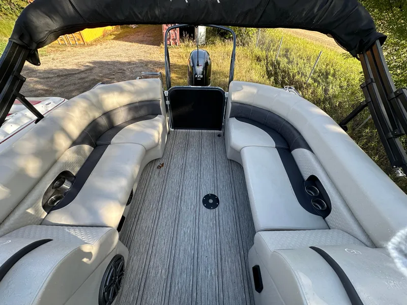 Slide: The Image of 2022 Premier 230 SunSation RF pontoon boat interior with spacious seating and modern design. - 12