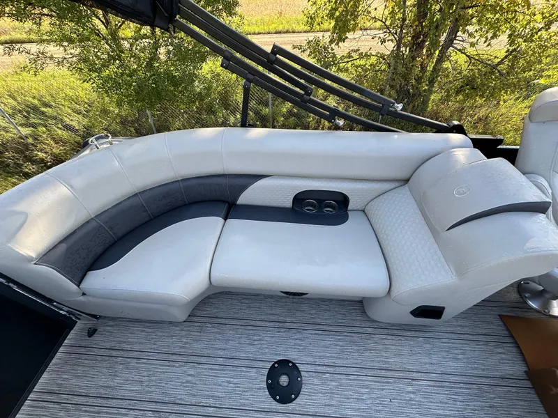 Slide: The Image of Luxurious seating on 2022 Premier 230 SunSation RF pontoon boat, featuring elegant upholstery. - 13
