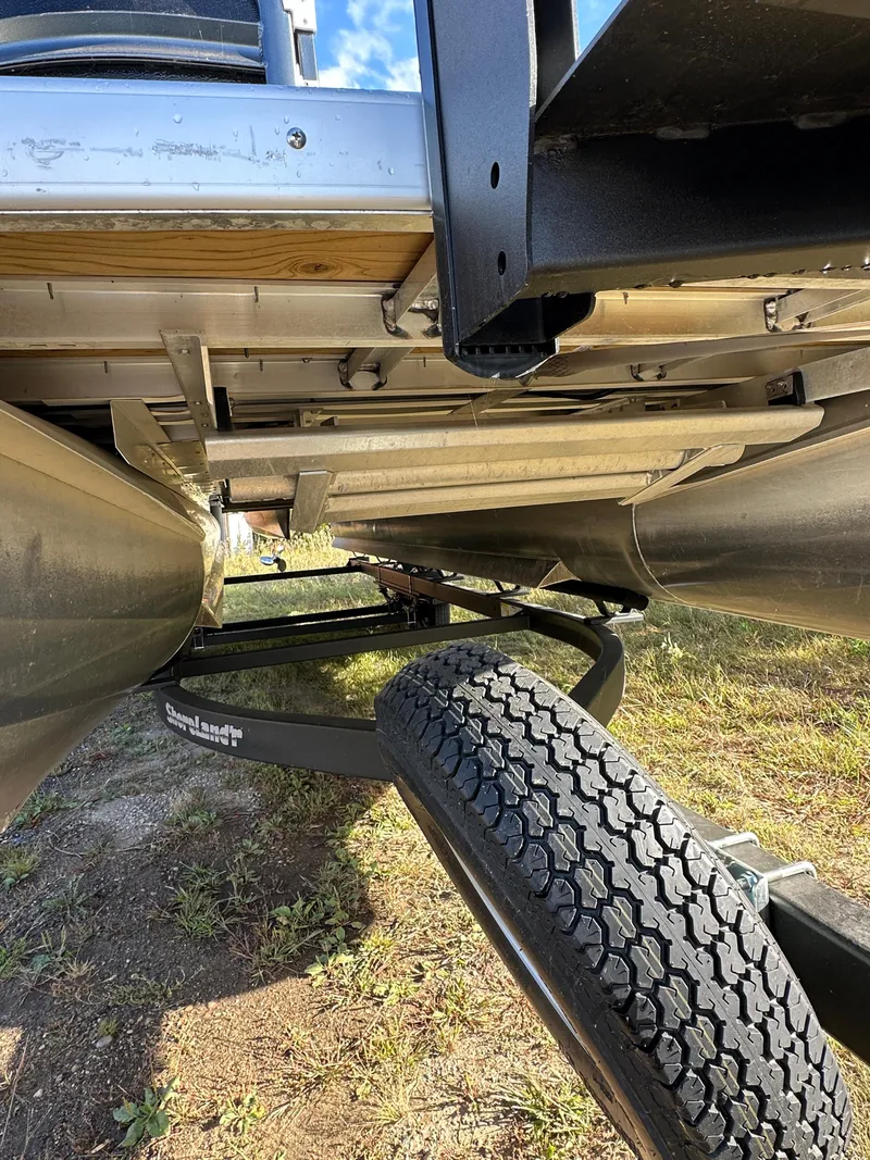 Slide: The Image of Underneath view of 2022 Premier 230 SunSation RF pontoon boat on trailer. - 17