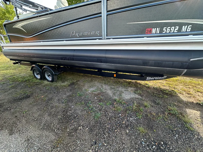 Slide: The Image of 2022 Premier 230 SunSation RF pontoon boat on trailer, side view. - 18