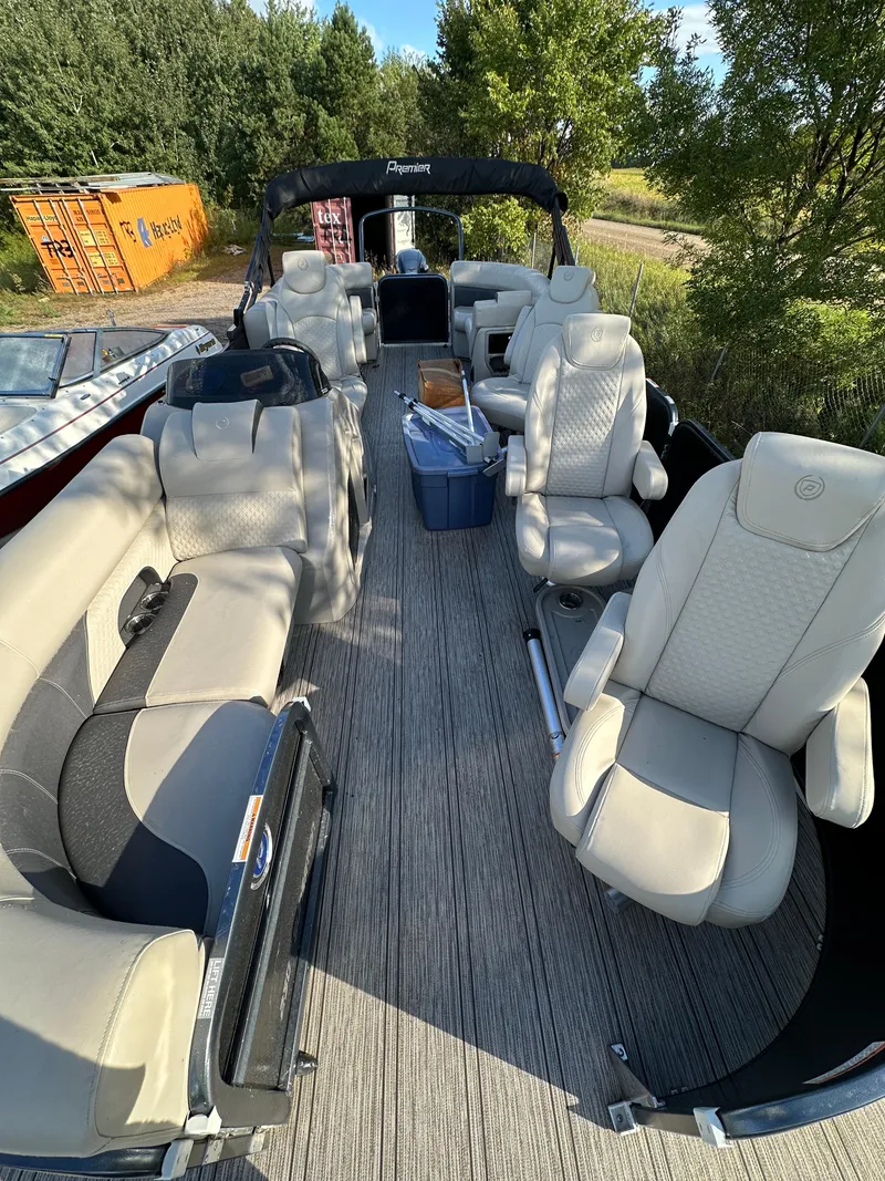 Slide: The Image of 2022 Premier 230 SunSation RF pontoon boat with spacious seating and modern design. - 2