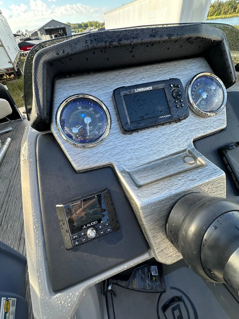 Slide: The Image of Dashboard of 2022 Premier 230 SunSation RF boat with navigation and control instruments. - 6