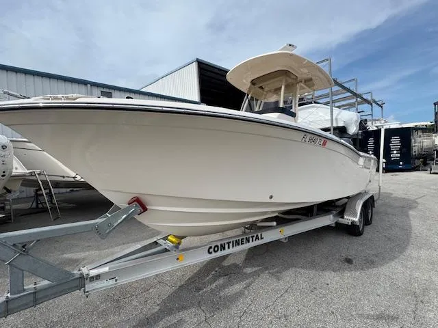 Slide: The Image of 2023 Grady-White Fisherman 257 boat on trailer in marina setting. - 0