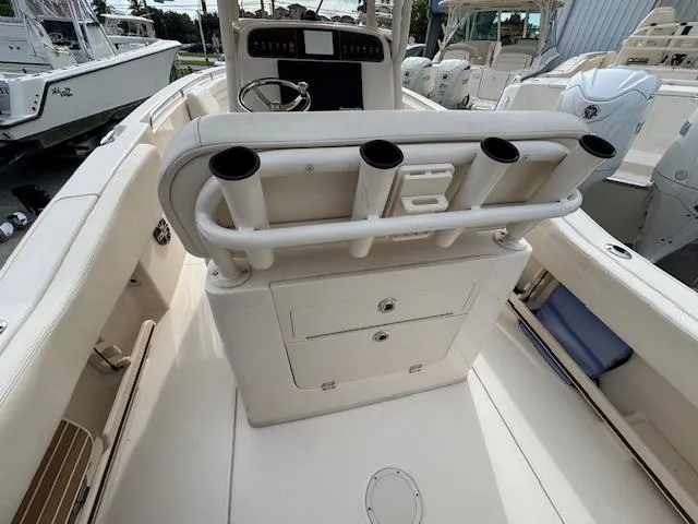 Slide: The Image of 2023 Grady-White Fisherman 257 boat interior with rod holders and storage compartments. - 15