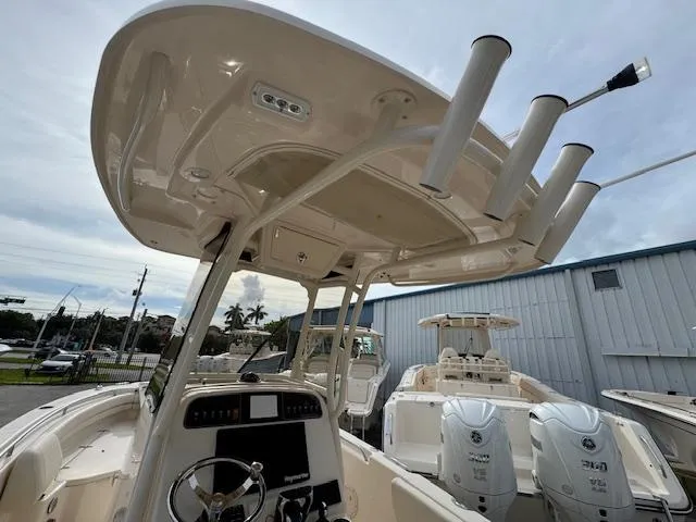 Slide: The Image of 2023 Grady-White Fisherman 257 boat interior with helm and rod holders. - 16