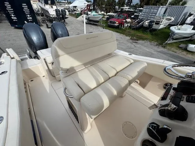 Slide: The Image of 2023 Grady-White Fisherman 257 boat interior with seating and dual engines. - 18