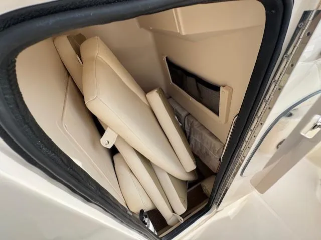 Slide: The Image of 2023 Grady-White Fisherman 257 storage compartment with folded seats. - 19