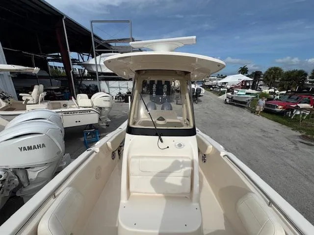 Slide: The Image of 2023 Grady-White Fisherman 257 boat with Yamaha engines at a marina. - 24