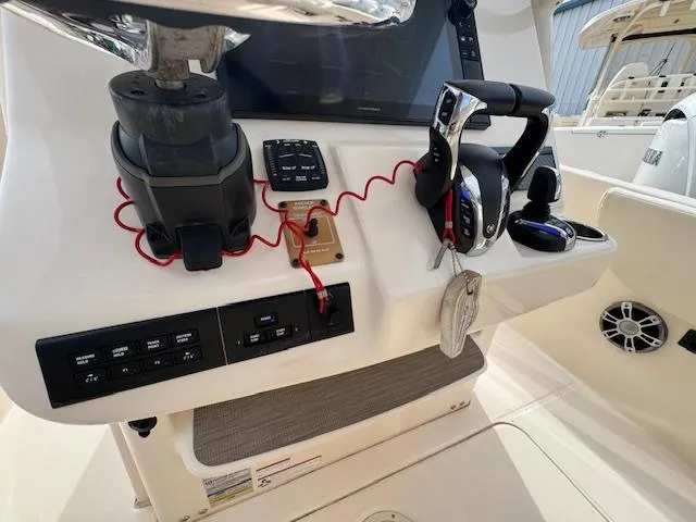 Slide: The Image of Grady-White Fisherman 257 console with controls and electronics, 2023 model. - 26