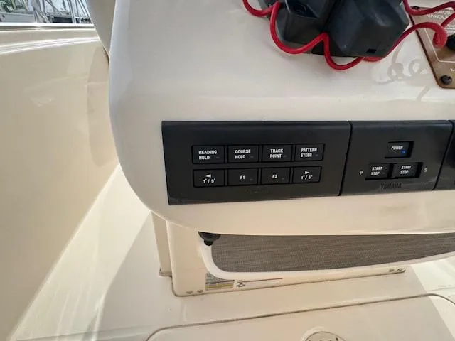 Slide: The Image of Control panel of 2023 Grady-White Fisherman 257 boat with navigation buttons. - 27