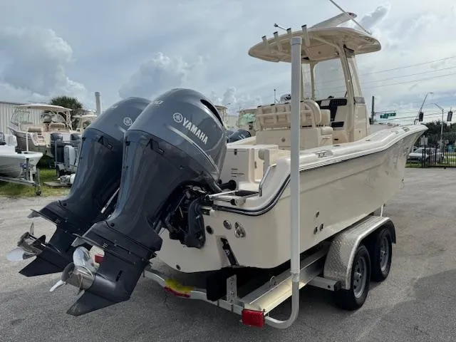 Slide: The Image of 2023 Grady-White Fisherman 257 boat with dual Yamaha engines on a trailer. - 3