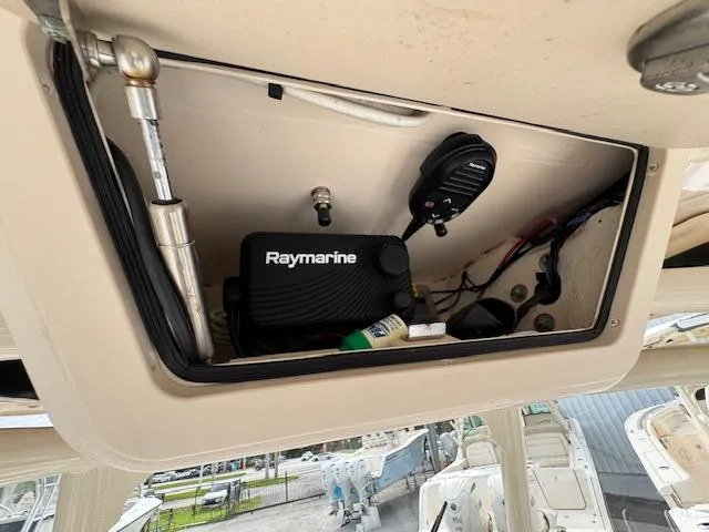 Slide: The Image of 2023 Grady-White Fisherman 257 boat electronics compartment with Raymarine equipment. - 32