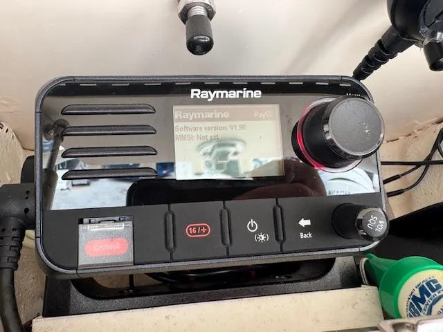 Slide: The Image of Raymarine marine radio on 2023 Grady-White Fisherman 257 boat dashboard. - 38