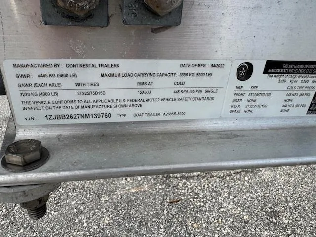 Slide: The Image of Boat trailer label with specifications for Grady-White Fisherman 257, 2023 model. - 7
