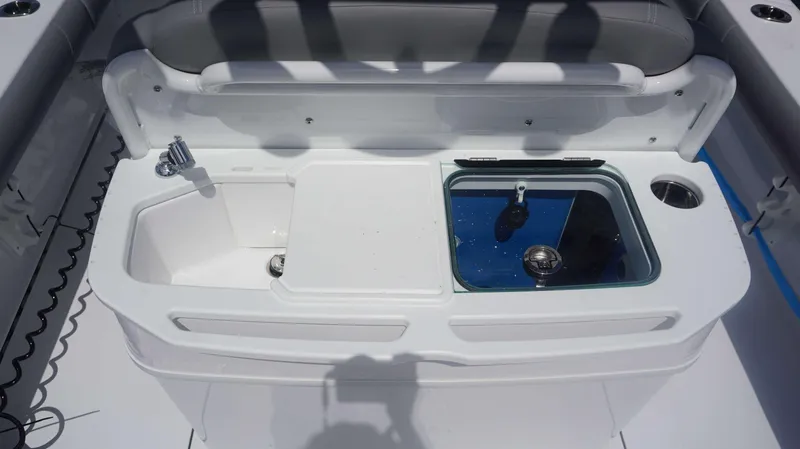 Slide: The Image of 2025 Everglades 273 CC boat interior with sink and livewell. - 19