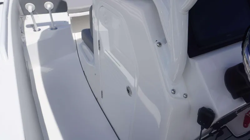 Slide: The Image of Close-up of 2025 Everglades 273 CC boat interior, showcasing sleek design and controls. - 22