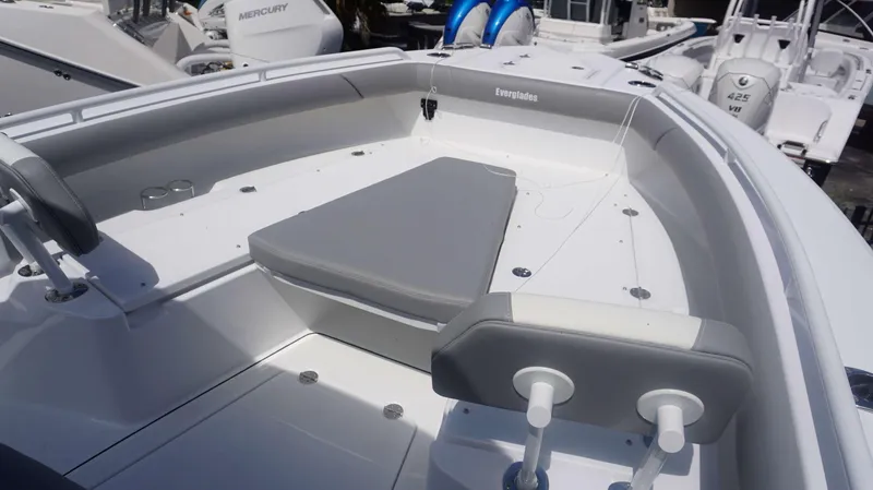 Slide: The Image of 2025 Everglades 273 CC boat interior with seating and storage. - 6