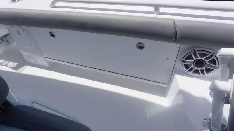 Slide: The Image of 2025 Everglades 273 CC boat interior with speaker and cushioned seating. - 8