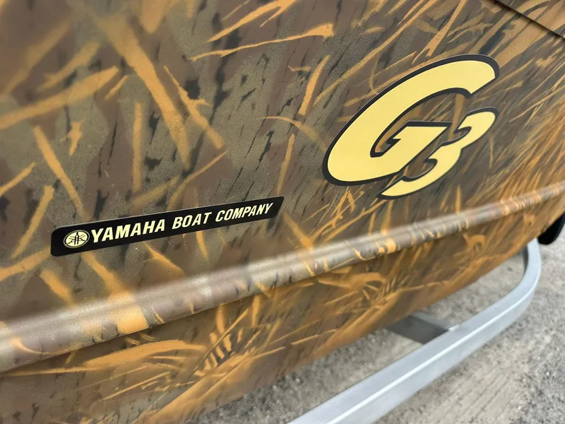Slide: The Image of 2025 G3 Gator Tough 18 CC boat with camouflage design and Yamaha Boat Company logo. - 10