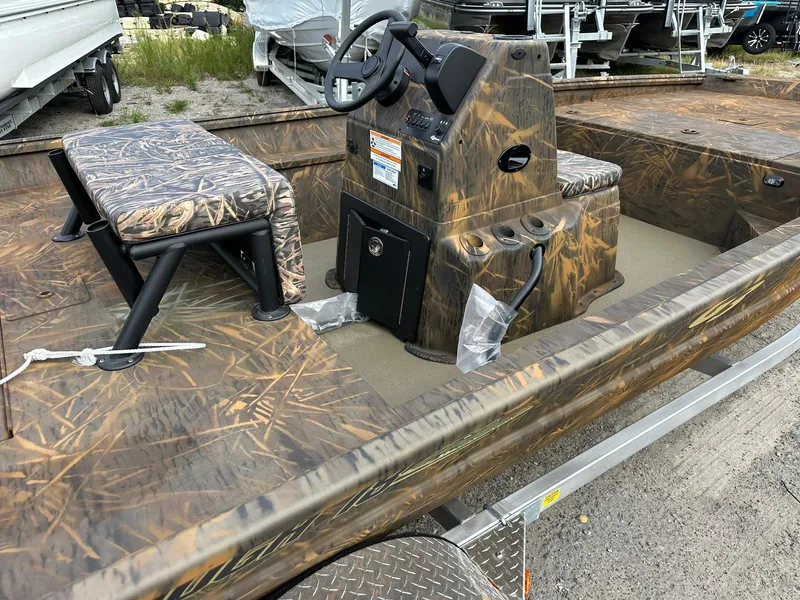 Slide: The Image of 2025 G3 Gator Tough 18 CC boat with camo design and central console. - 14