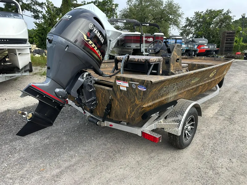 Slide: The Image of 2025 G3 Gator Tough 18 CC boat with Yamaha outboard motor on trailer. - 2