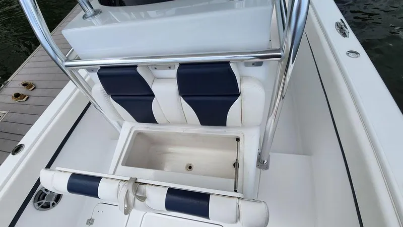 Slide: The Image of 2015 Bluewater 2550 boat interior with seating and storage compartment. - 14