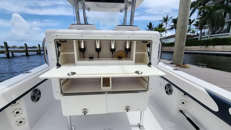 Slide: The Image of 2015 Bluewater 2550 boat with open storage compartment at dockside. - 21