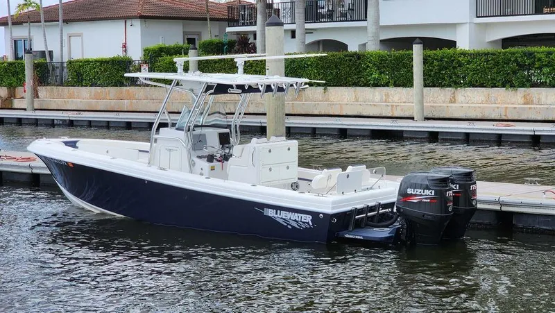 Slide: The Image of 2015 Bluewater 2550 boat docked with Suzuki outboard engines. - 3