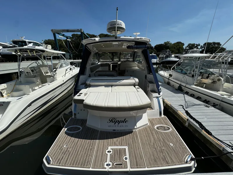 Slide: The Image of 2016 Regal 35 Sport Coupe yacht docked at marina, rear view. - 13