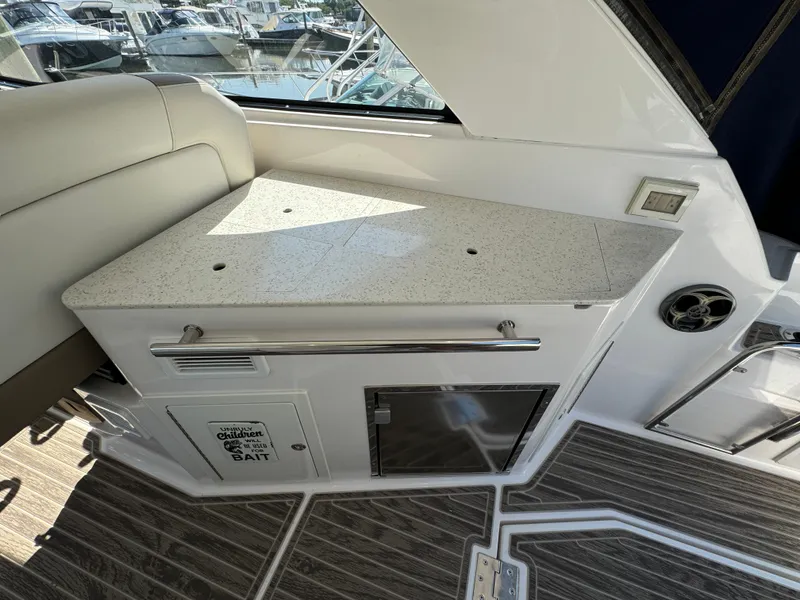 Slide: The Image of 2016 Regal 35 Sport Coupe interior with countertop and seating area. - 19