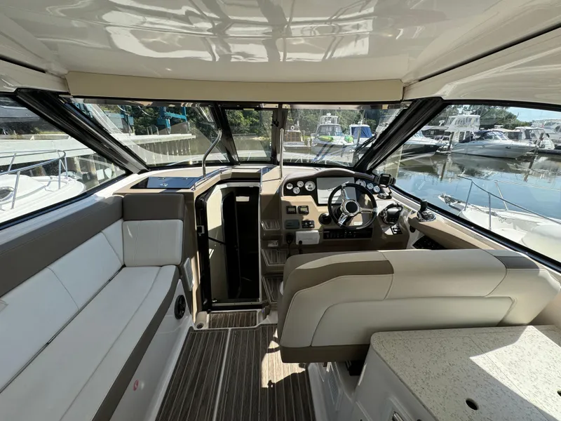 Slide: The Image of Interior of 2016 Regal 35 Sport Coupe yacht with modern helm and seating. - 20