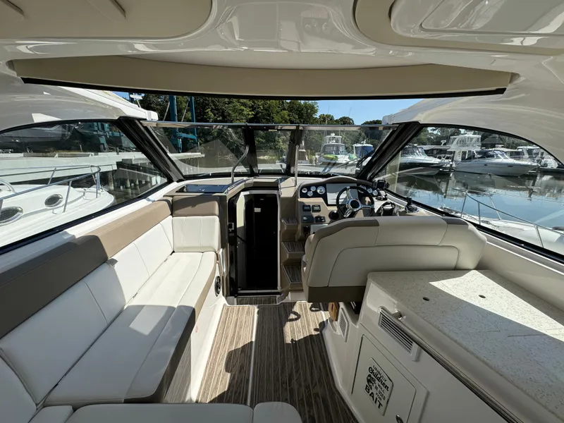 Slide: The Image of Interior of 2016 Regal 35 Sport Coupe yacht with luxurious seating and helm. - 21