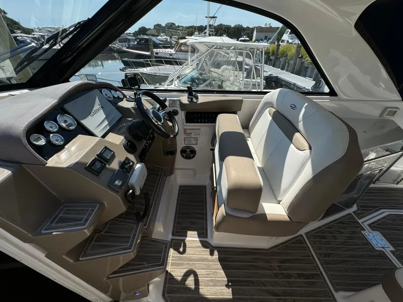 Slide: The Image of 2016 Regal 35 Sport Coupe cockpit with modern controls and comfortable seating. - 25