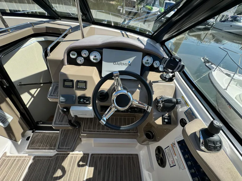 Slide: The Image of 2016 Regal 35 Sport Coupe helm with Garmin navigation system and modern controls. - 27